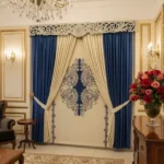 velvet curtains in beige and blue color with handmade wooden carved pelmet in silver finish