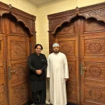 Hand-carved rosewood main door with intricate detailing