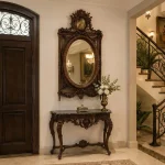 Designer console in solid wood with hand-carved wooden mirror frame and natural light brown polish finish.