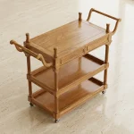 Handcrafted rosewood wood bar cart with three tiers and smooth wheels by HBFurnitures, handmade solid sheesham tea trolley for home bar storage.